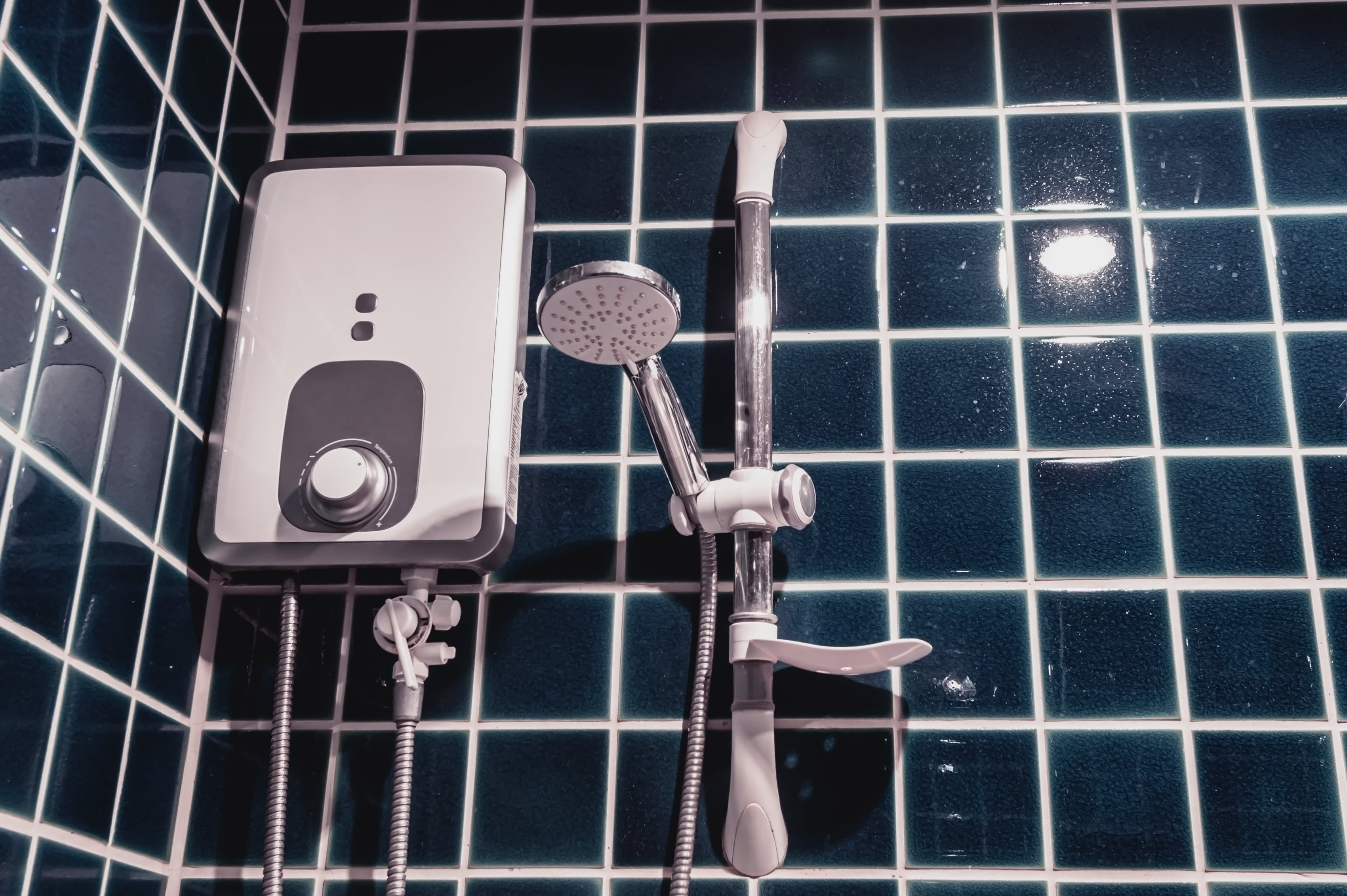 Gas Safe certified plumber installing a tankless water heater in Feltham